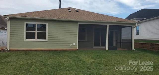 a large bed sitting in a bedroom next to a window