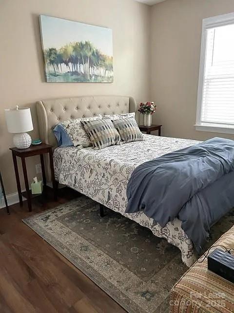515 Bowline Drive Denver, NC 28037 - Photo 5 of 25 a bedroom with a bed and wooden floor