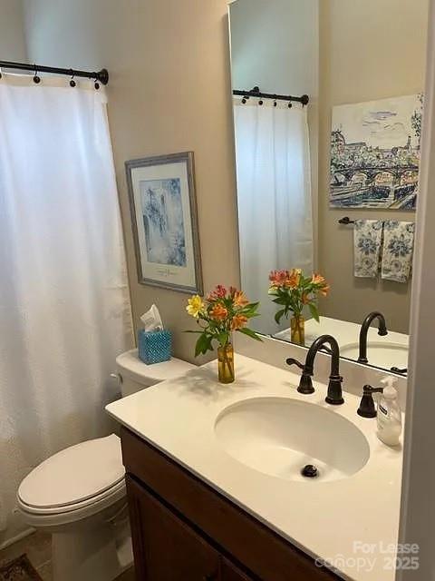 515 Bowline Drive Denver, NC 28037 - Photo 6 of 25 a bathroom with a sink a toilet and a mirror