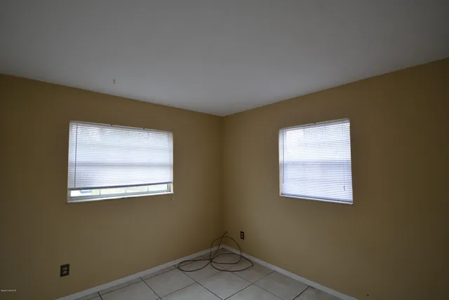 a bathroom with a sink toilet and mirror