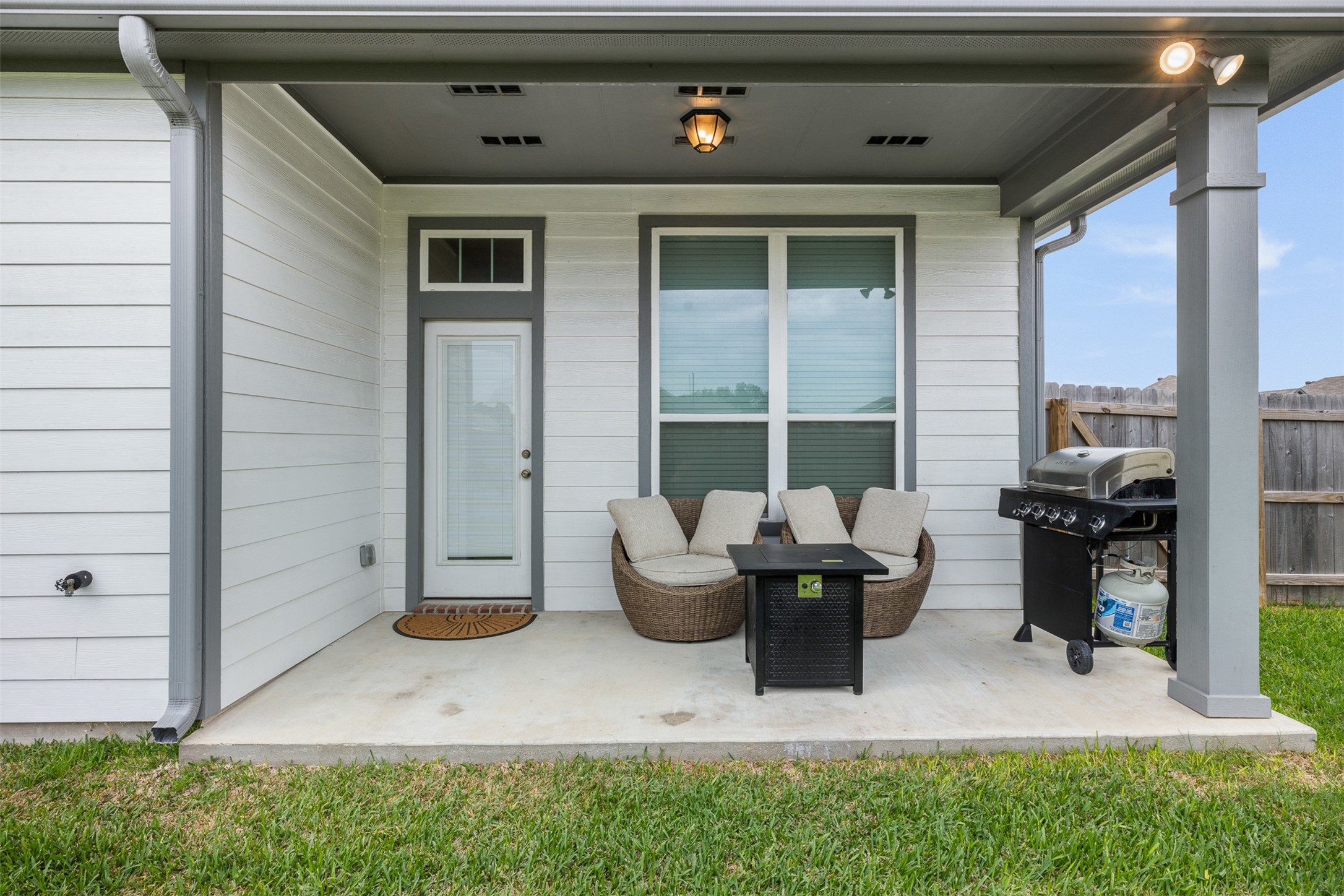 1968 Chief Street Bryan, TX 77807 - Photo 18 of 27 Charming covered patio with cozy seating, outdoor lighting, and a barbecue grill, perfect for relaxing or entertaining.
