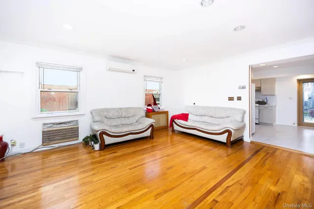 a bedroom with furniture and a window