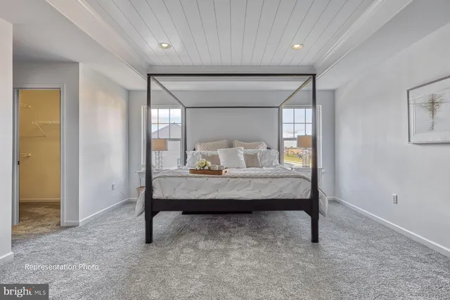 a view of room with furniture and wooden floor