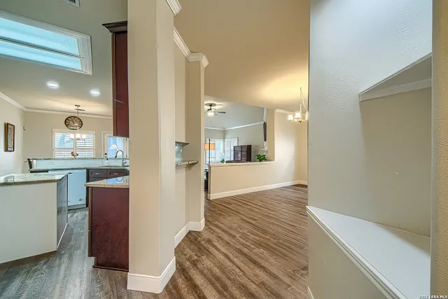 a view of a kitchen cabinets and wooden floor