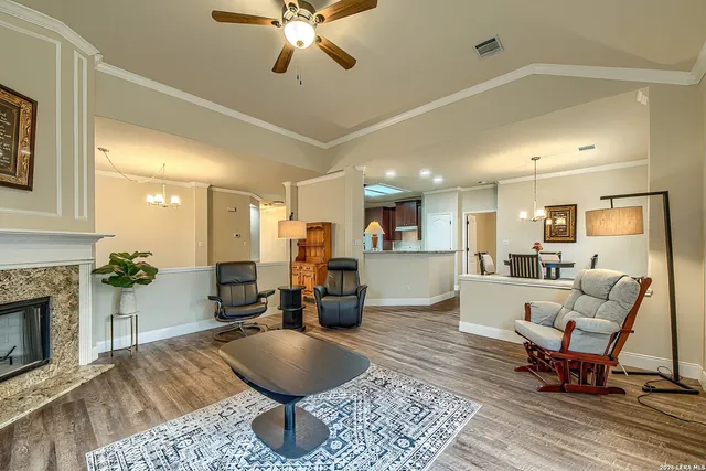 a living room with furniture and a fireplace