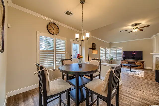 a view of a dining room with furniture and wooden floor