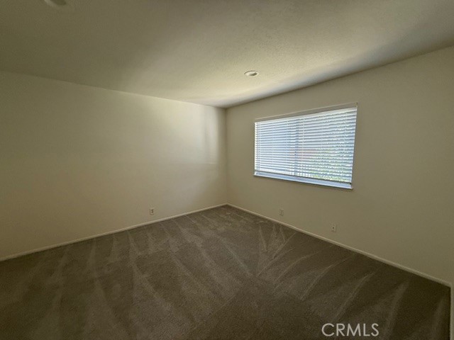 27648 Susan Beth Way, Unit H Saugus, CA 91350 - Photo 17 of 21 an empty room with a window