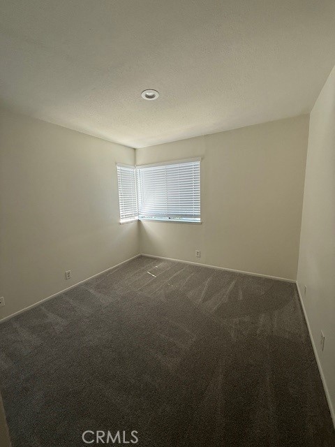 27648 Susan Beth Way, Unit H Saugus, CA 91350 - Photo 8 of 21 an empty room with a empty space and window