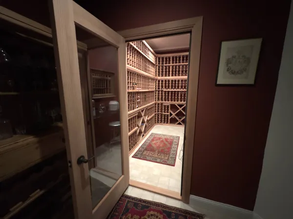 a living room with furniture and a hard wood floor