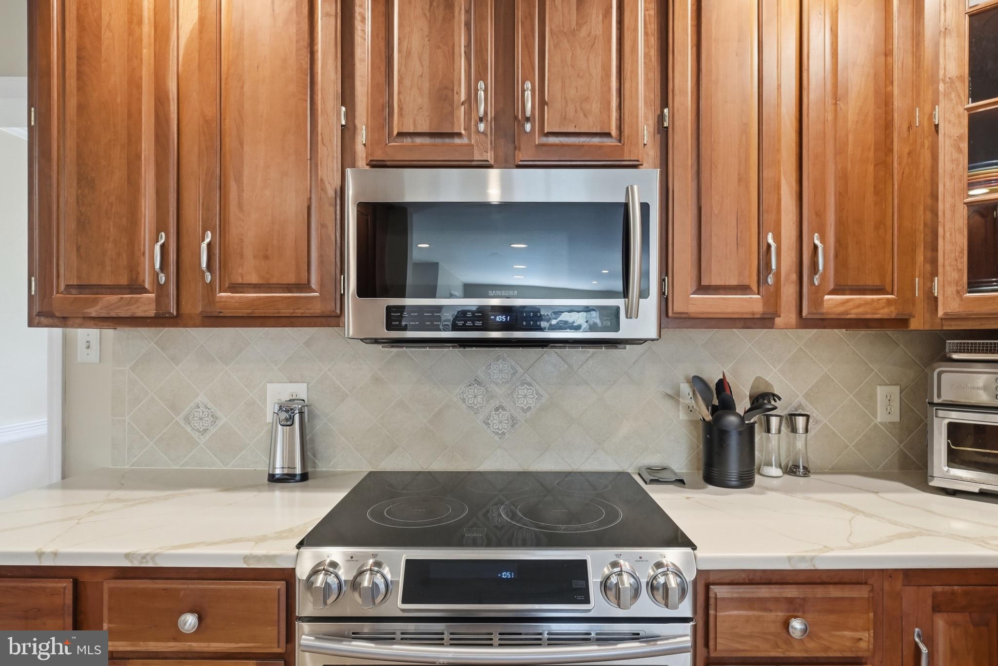 11337 Old Stillhouse Road Boston, VA 22713 - Photo 26 of 58 a kitchen with granite countertop a stove and cabinets