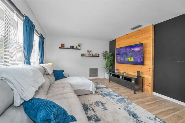a view of a livingroom with furniture and a window