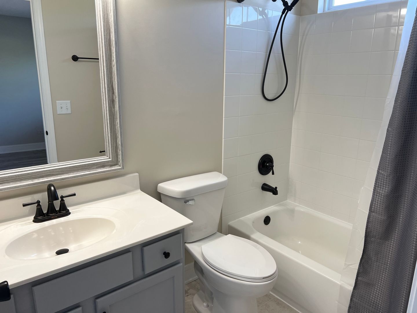 Undisclosed Address Lockport, IL 60441 - Photo 14 of 17 a bathroom with a sink a toilet and a mirror