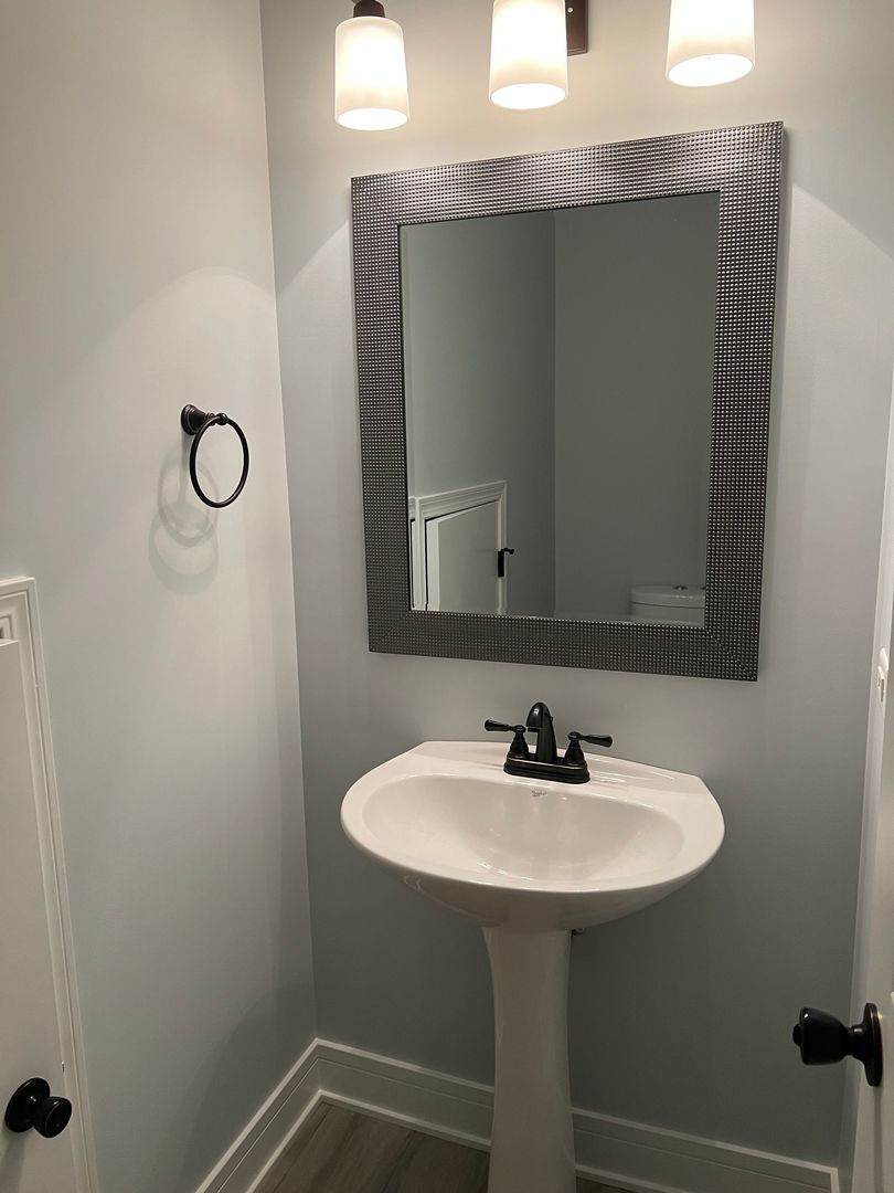 Undisclosed Address Lockport, IL 60441 - Photo 16 of 17 a bathroom with a sink and a mirror