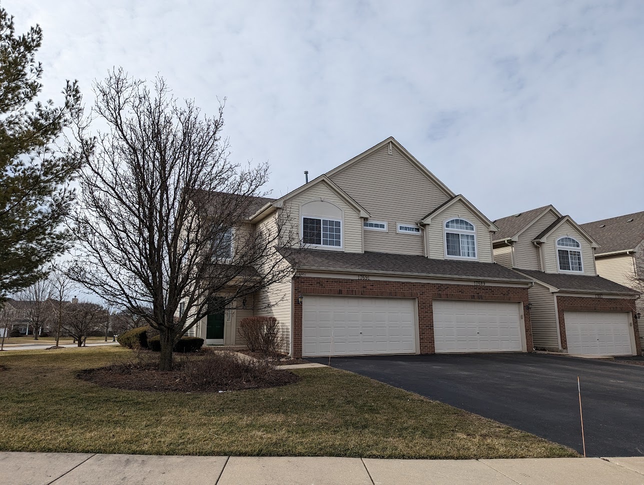 Undisclosed Address Lockport, IL 60441 - Photo 2 of 17 a view of a house with a yard