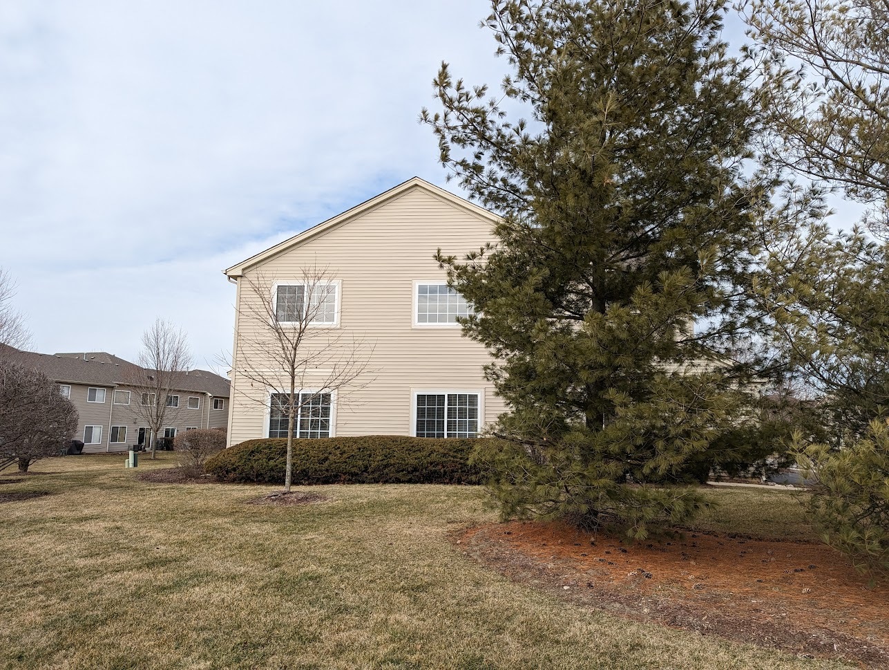 Undisclosed Address Lockport, IL 60441 - Photo 4 of 17 a view of a house with a yard