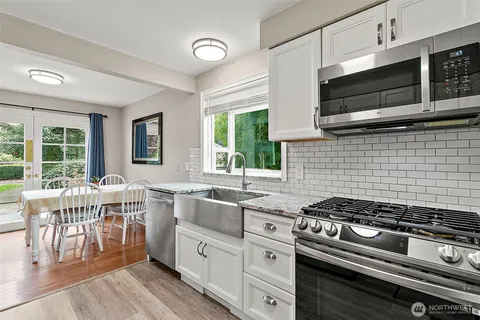 a kitchen with a stove and a sink