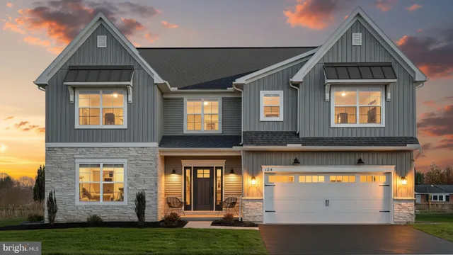 a view of a brick house with a yard