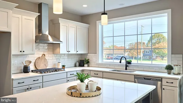 a kitchen with stainless steel appliances a sink a stove and a window