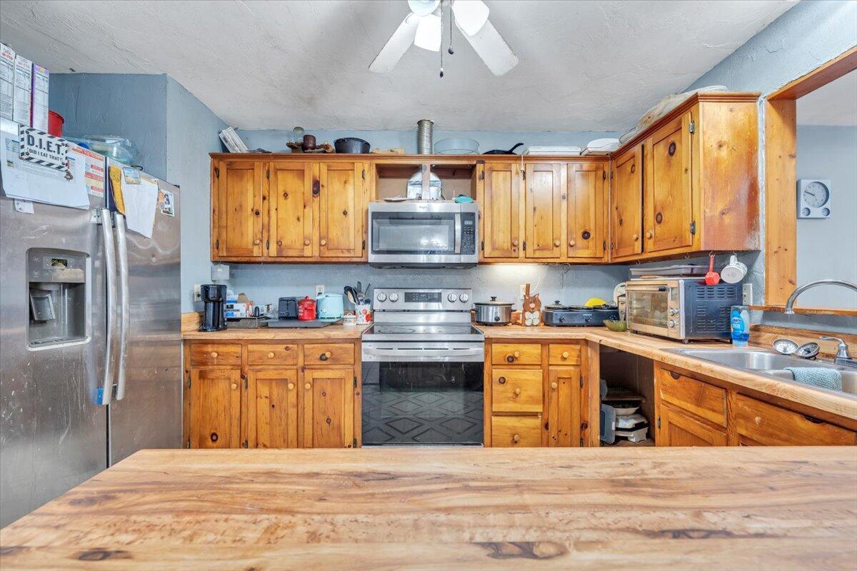 68 Old Sawmill Road Blue Ridge, VA 24064 - Photo 12 of 43 a kitchen with stainless steel appliances granite countertop a stove and a sink