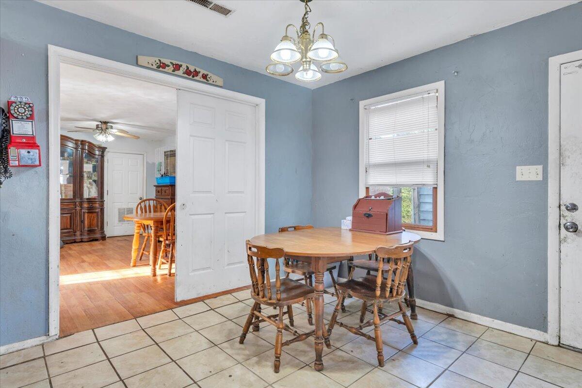 68 Old Sawmill Road Blue Ridge, VA 24064 - Photo 14 of 43 a view of a dining room with furniture and chandelier