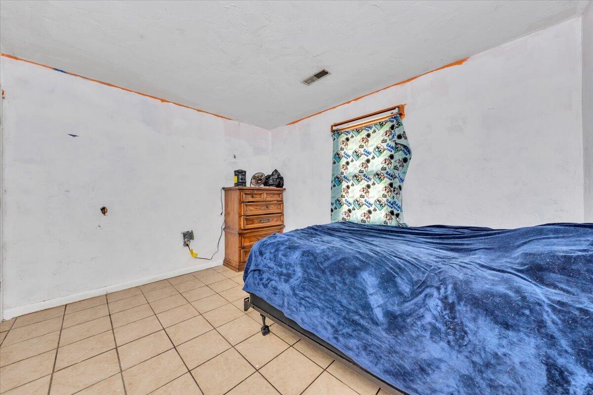 68 Old Sawmill Road Blue Ridge, VA 24064 - Photo 26 of 43 a bedroom with a bed and a window