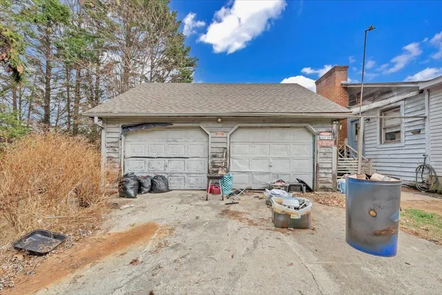 a view of a chairs and table in the patio