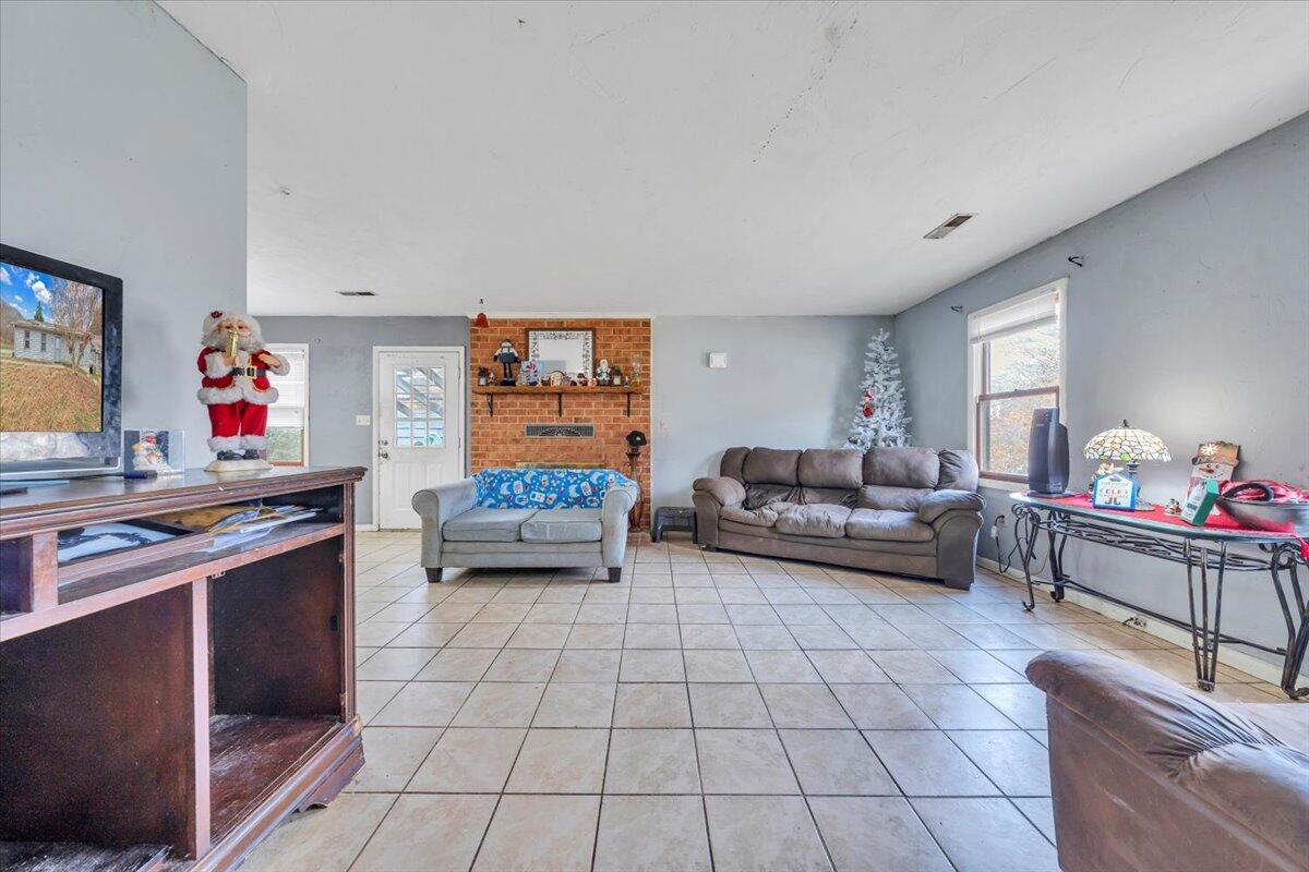 68 Old Sawmill Road Blue Ridge, VA 24064 - Photo 5 of 43 a living room with furniture and a flat screen tv