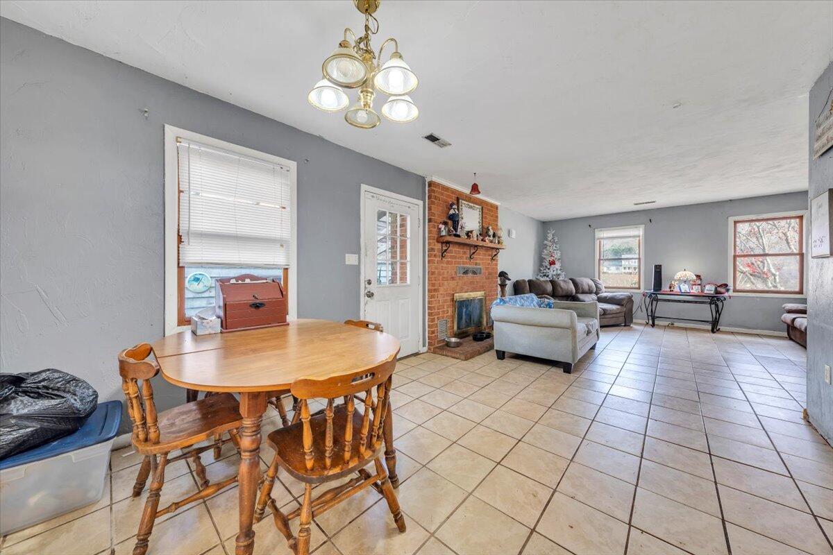 68 Old Sawmill Road Blue Ridge, VA 24064 - Photo 9 of 43 a living room with furniture and a chandelier