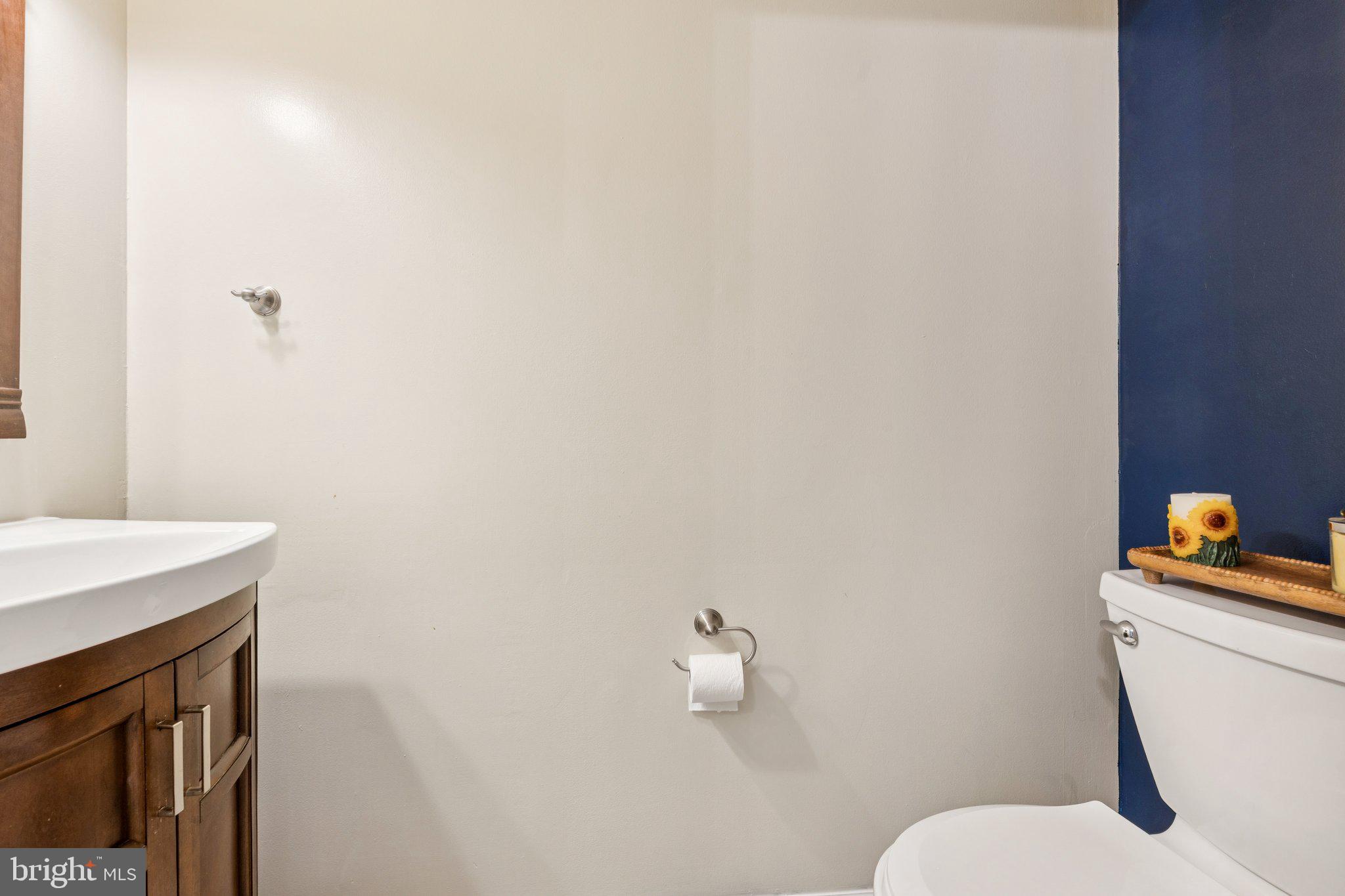 2009 Swans Neck Way Reston, VA 20191 - Photo 13 of 37 a bathroom with a sink a toilet and a mirror