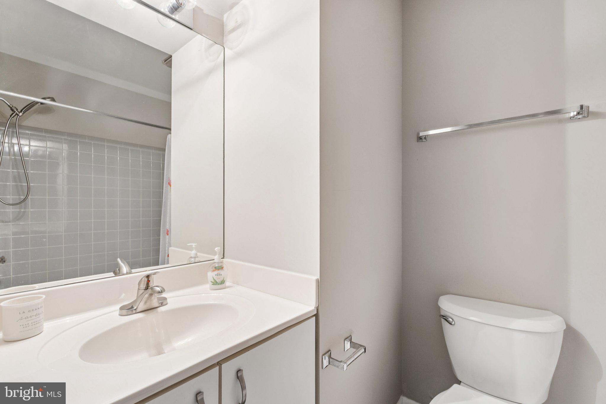 2009 Swans Neck Way Reston, VA 20191 - Photo 18 of 37 a bathroom with a toilet sink and mirror