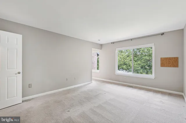 a view of an empty room and window