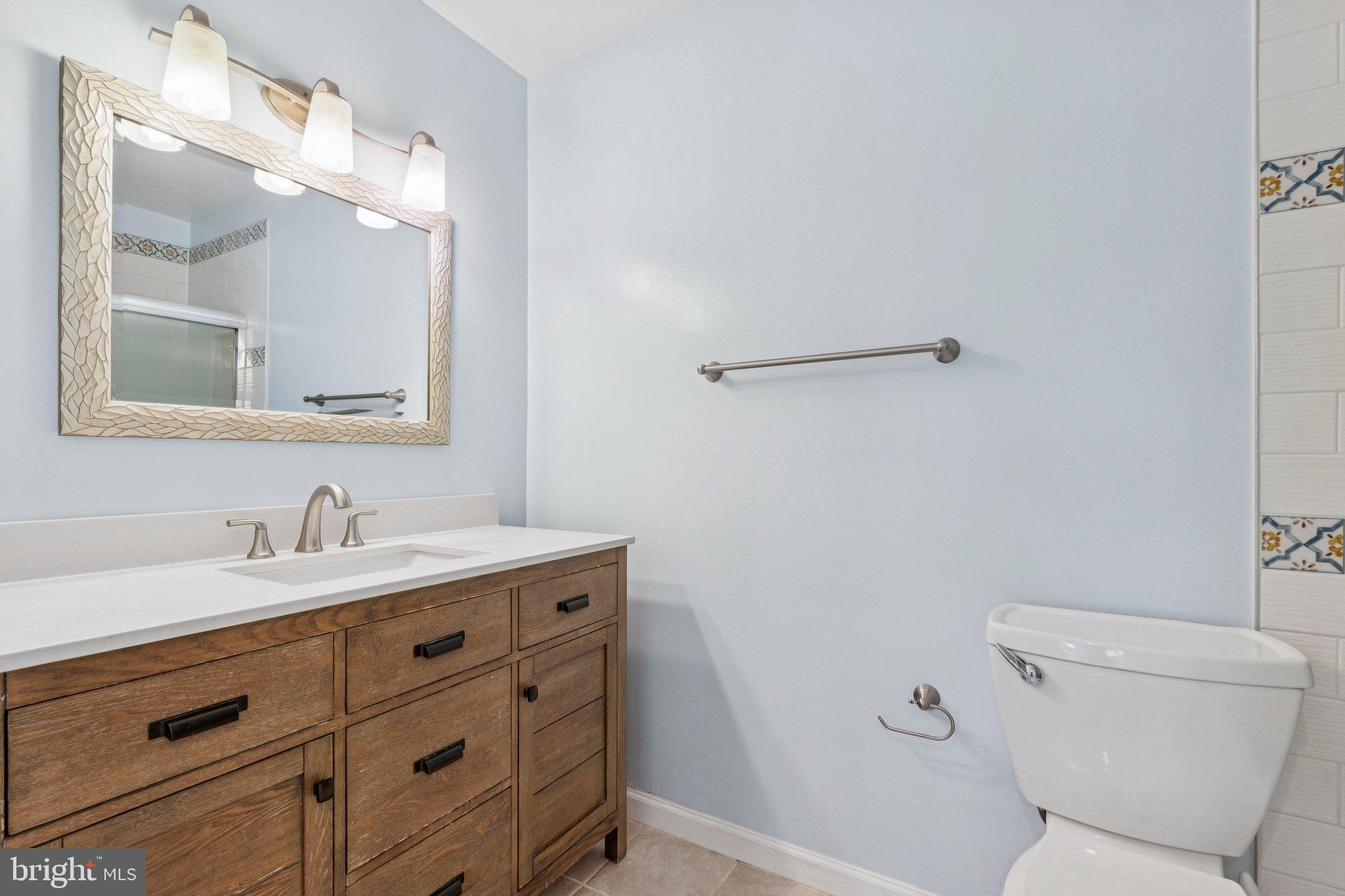 2009 Swans Neck Way Reston, VA 20191 - Photo 24 of 37 a bathroom with a granite countertop sink vanity mirror and toilet