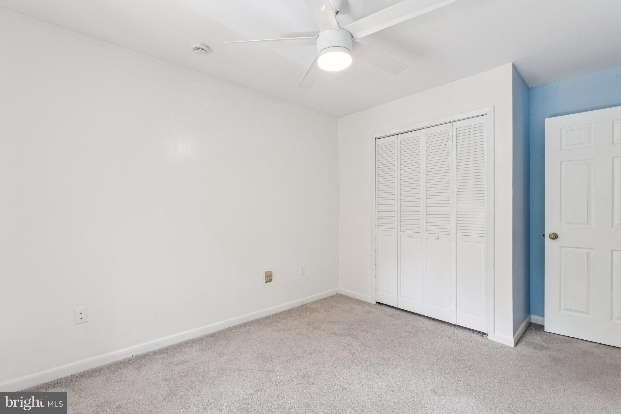 2009 Swans Neck Way Reston, VA 20191 - Photo 29 of 37 an empty room with a ceiling fan and a window