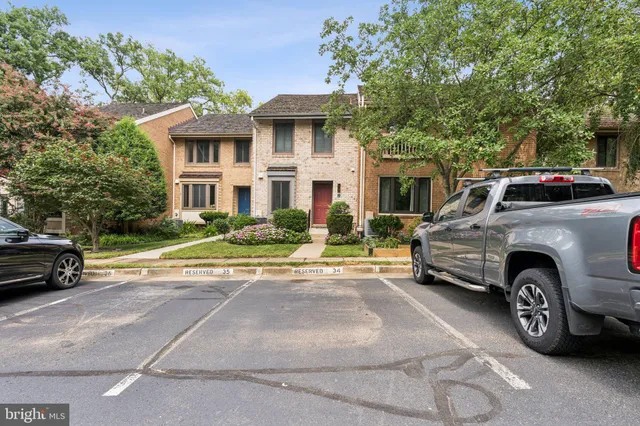 a view of a car parked in front of a house