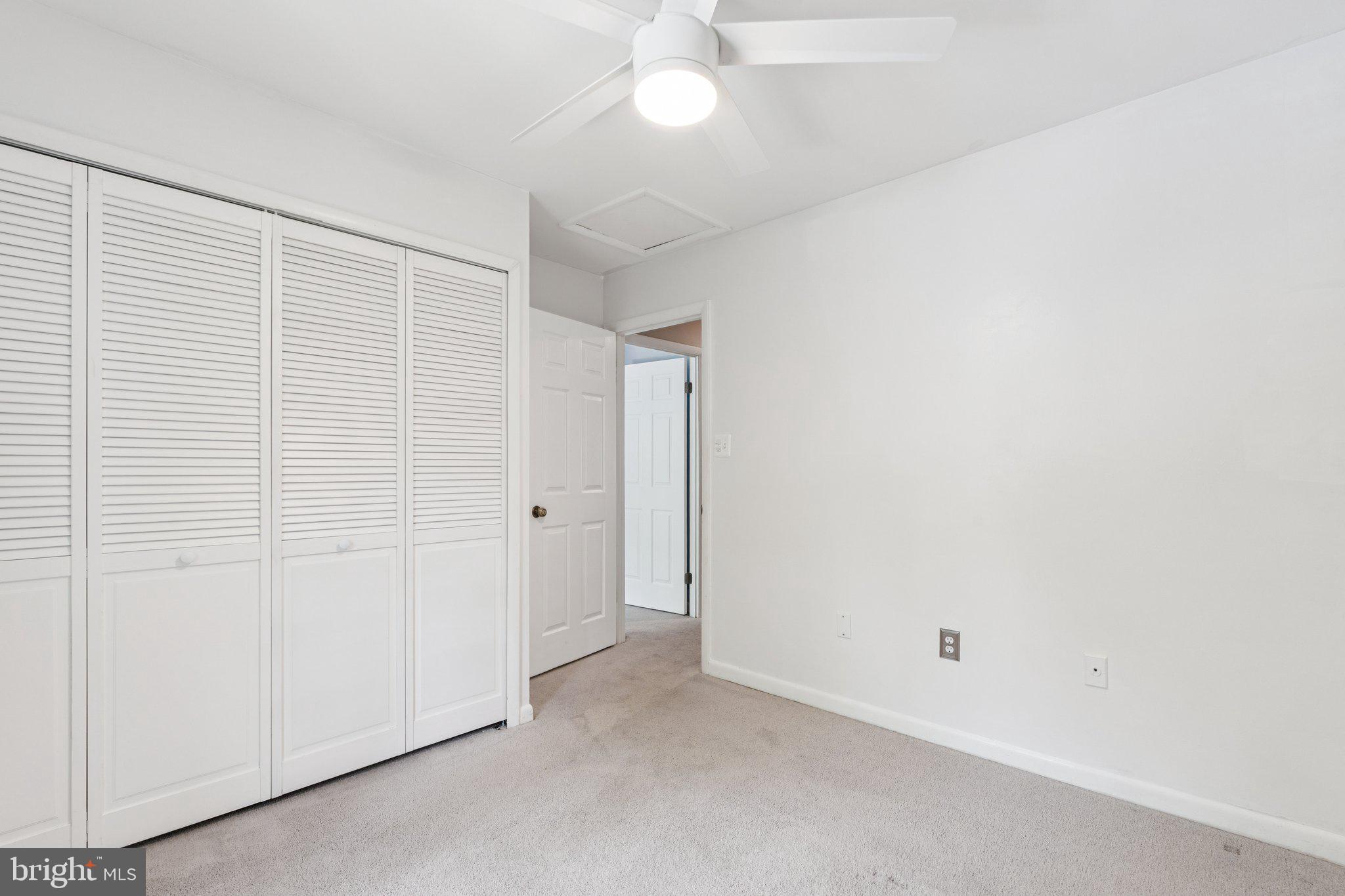 2009 Swans Neck Way Reston, VA 20191 - Photo 31 of 37 an empty room with a ceiling fan and a window