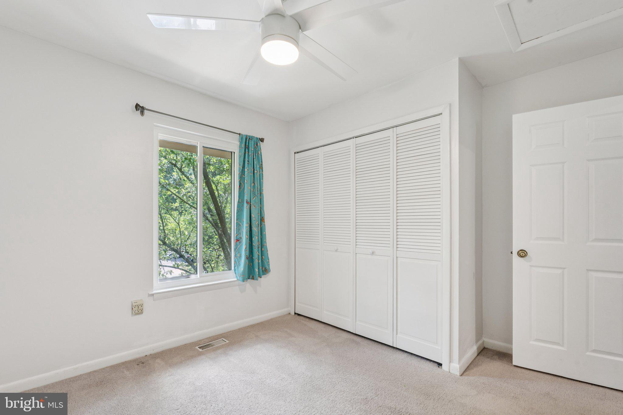 2009 Swans Neck Way Reston, VA 20191 - Photo 32 of 37 an empty room with windows and closet