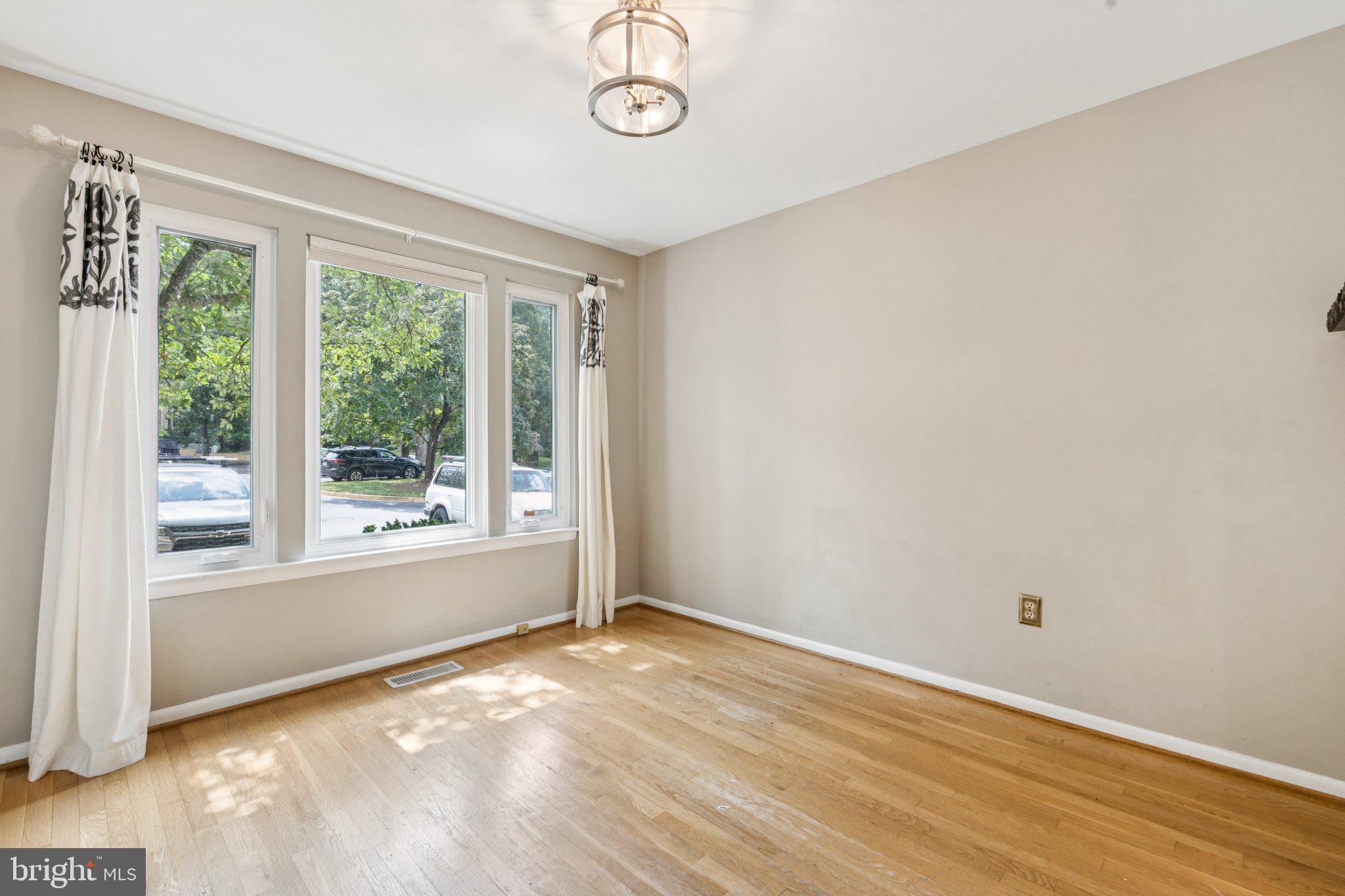 2009 Swans Neck Way Reston, VA 20191 - Photo 5 of 37 a view of a livingroom with wooden floor and window