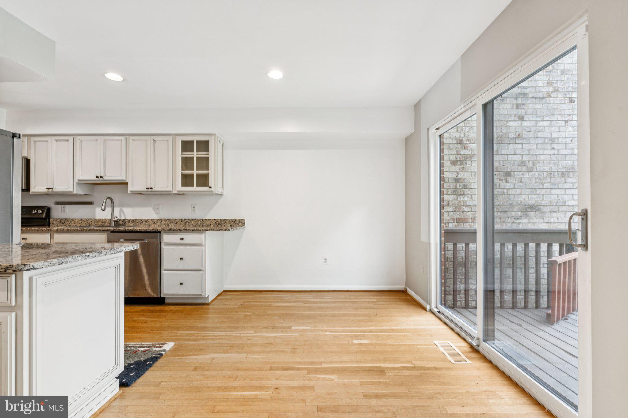 2009 Swans Neck Way Reston, VA 20191 - Photo 9 of 37 a view of a kitchen with wooden floor and a sink