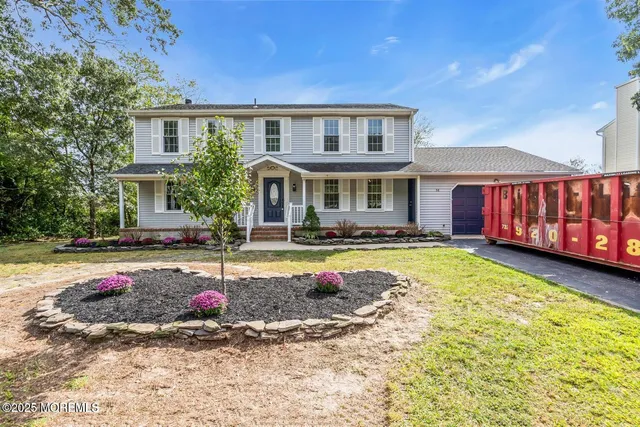 a swimming pool with outdoor seating