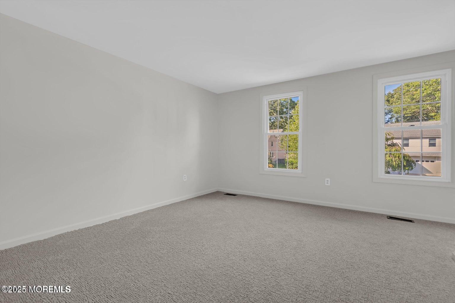 58 Garden Avenue Island Heights, NJ 08732 - Photo 12 of 46 an empty room with windows
