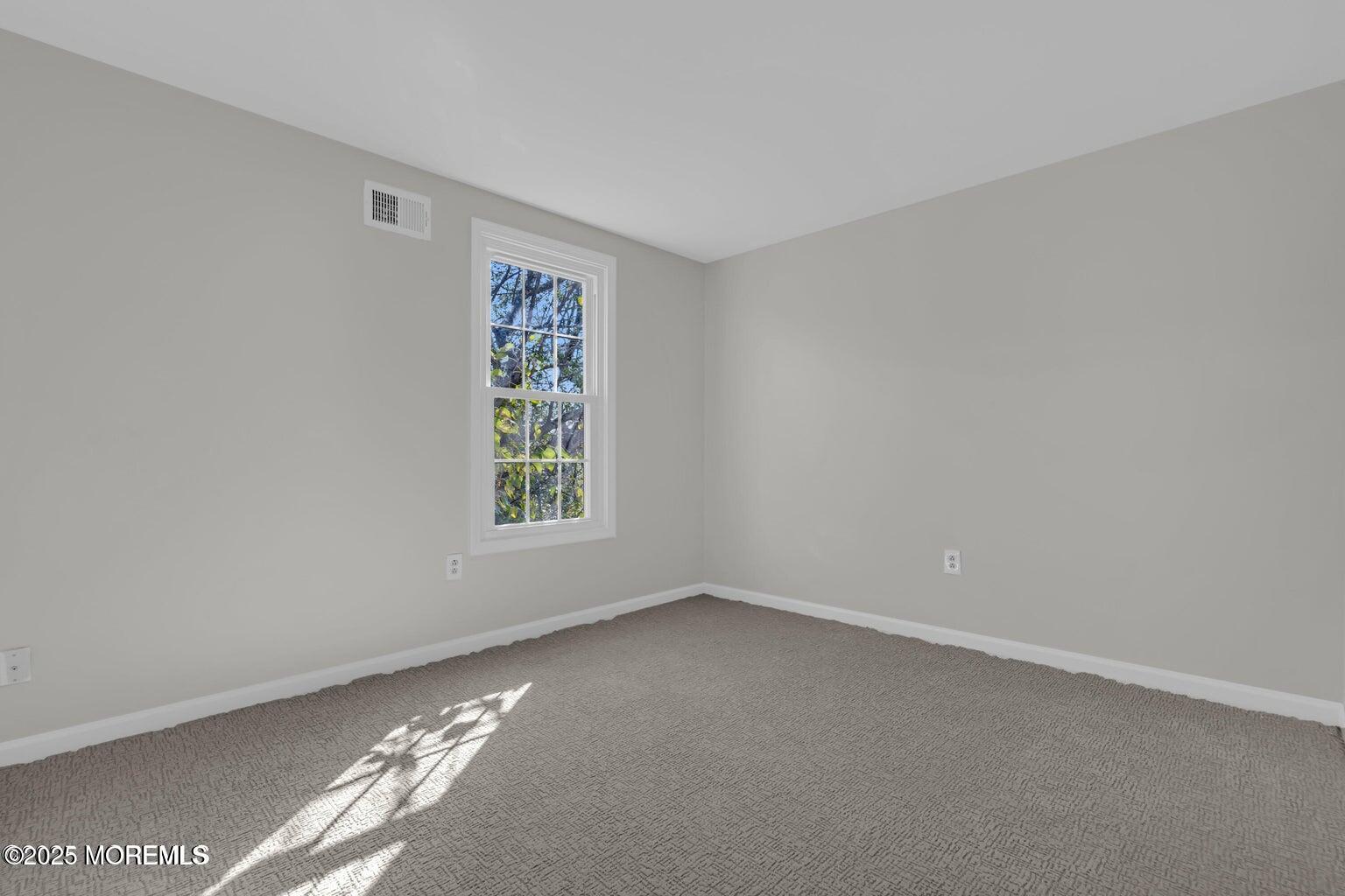 58 Garden Avenue Island Heights, NJ 08732 - Photo 14 of 46 a view of an empty room with a window