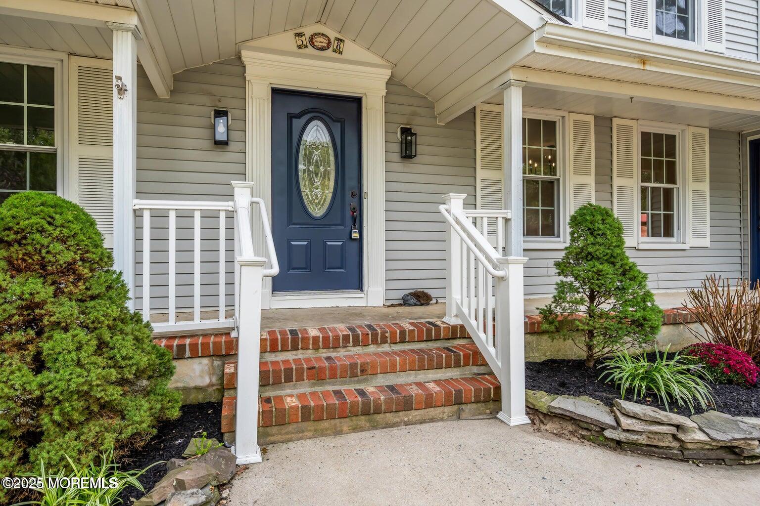 58 Garden Avenue Island Heights, NJ 08732 - Photo 2 of 46 a front view of a house with plants