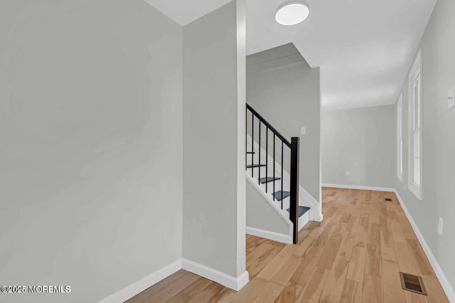 58 Garden Avenue Island Heights, NJ 08732 - Photo 29 of 46 a view of a hallway with wooden floor and entryway