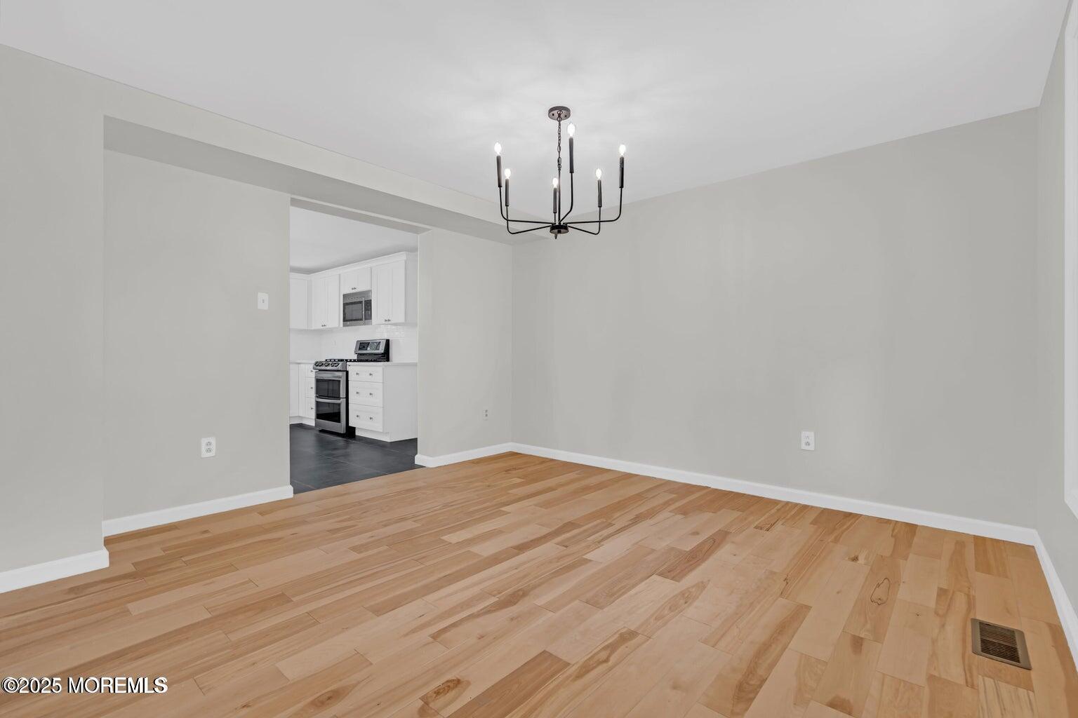 58 Garden Avenue Island Heights, NJ 08732 - Photo 31 of 46 a view of empty room with wooden floor