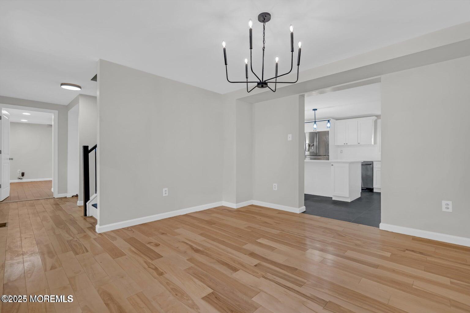 58 Garden Avenue Island Heights, NJ 08732 - Photo 32 of 46 a view of empty room with wooden floor and ceiling fan