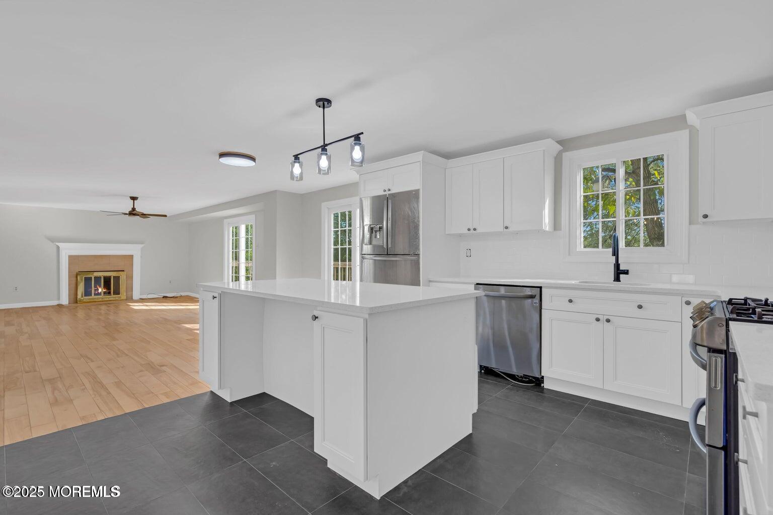 58 Garden Avenue Island Heights, NJ 08732 - Photo 33 of 46 a kitchen with cabinets oven and a sink
