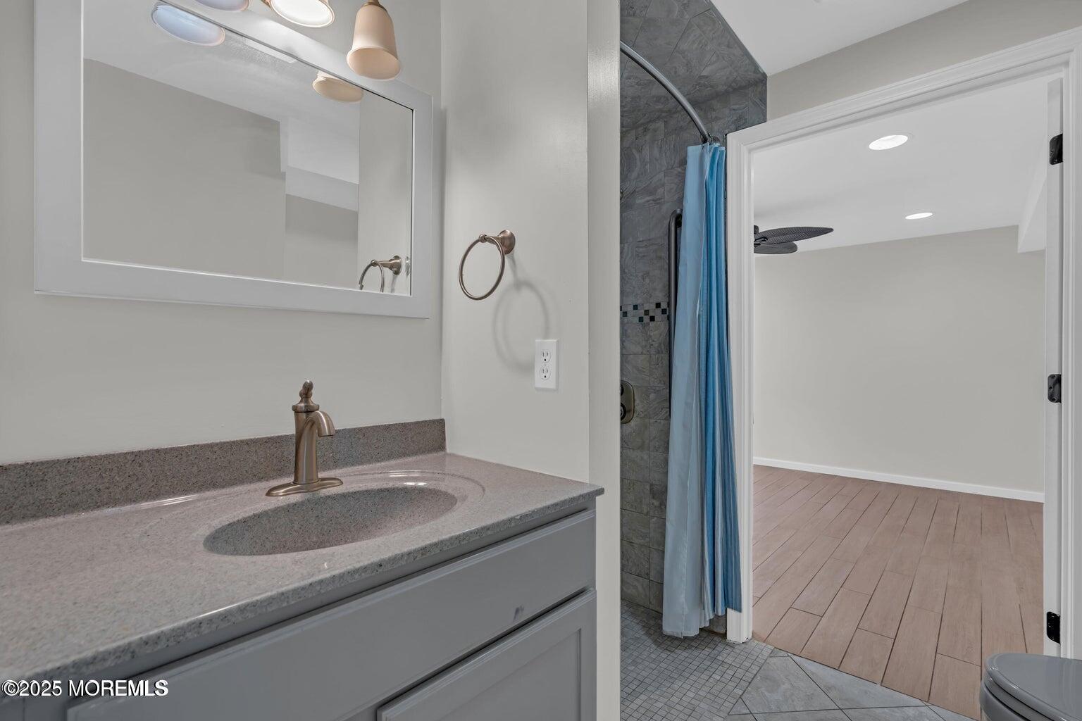 58 Garden Avenue Island Heights, NJ 08732 - Photo 37 of 46 a bathroom with a sink and a mirror