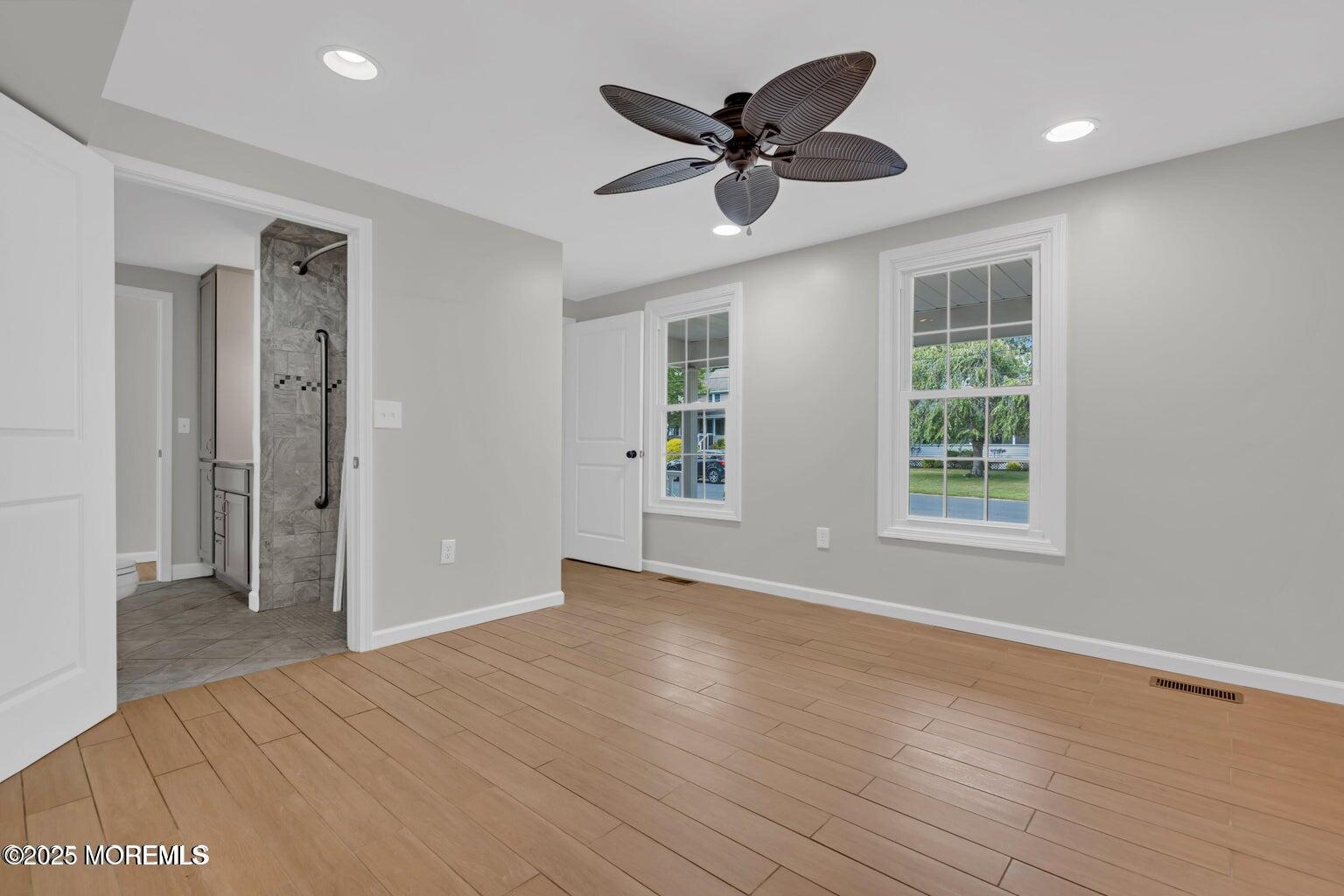 58 Garden Avenue Island Heights, NJ 08732 - Photo 39 of 46 a view of a big room with wooden floor and windows