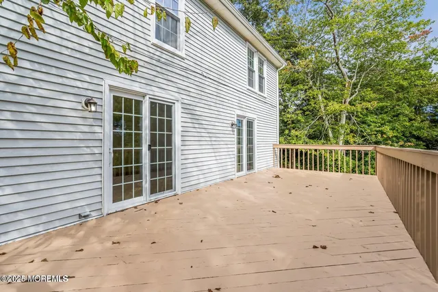 a view of a yard with large trees