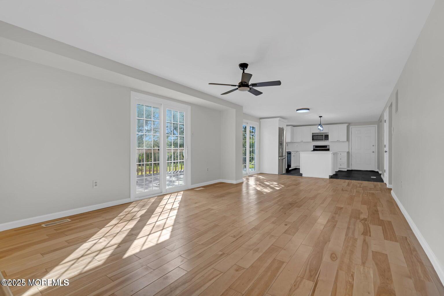 58 Garden Avenue Island Heights, NJ 08732 - Photo 8 of 46 a view of empty room with wooden floor and window